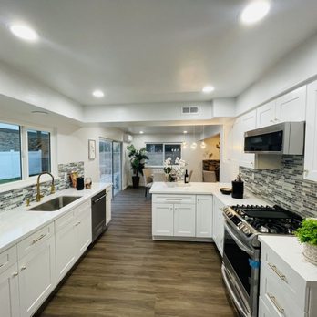 Modern Kitchen - a large kitchen with white cabinets and stainless steel appliances - Flooring Near Me - San Gabriel, California Modern Kitchen - a large kitchen with white cabinets and stainless steel appliances - Flooring Near Me - San Gabriel, California