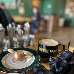 The Coffee MUGG - Butter Beer Latte and Golden Snitch cake ball.