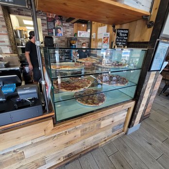 Oceanside Pizza - a display of pizzas and pastries - Pizza Near Me - Melbourne Beach, Florida Oceanside Pizza - a display of pizzas and pastries - Pizza Near Me - Melbourne Beach, Florida