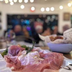 Bruschetta Mediterranean Cuisine - Fresh Burrata cheese mozzarella, Prosciutto di Parma ,Arugula and homemade Balsamic  vinaigrette reduction .