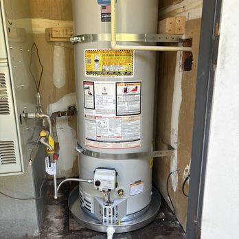 Water Heater Specialists - New tank with drip pan and overflow drainage pipe. - Water Heater Installation/Repair Near Me - Hayward, California