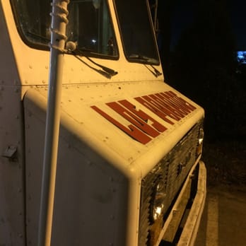 Los Parados - the front of a white truck at night - Mexican Near Me - North Charleston, South Carolina Los Parados - the front of a white truck at night - Mexican Near Me - North Charleston, South Carolina