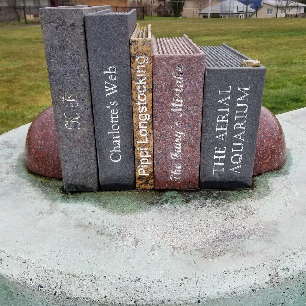 McCarver Park - Cute center area with book statue. A painted rock that I was hiding is on top of one book for someone to find. - Parks Near Me - Tacoma, Washington