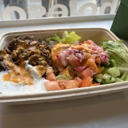 a salad in a styrofoam container