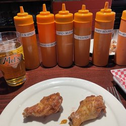Mel's On Madison - Wings and lots of bbq sauces