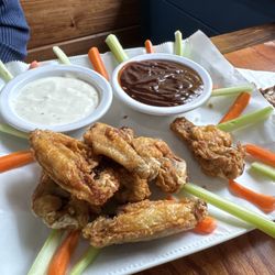 Half of the order of chicken wings. The first half is already gone.