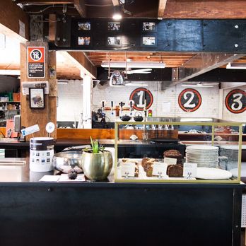 Rising Sun Workshop Cafe - Coffee bar with view of workshop - Cafes Near Me - Newtown, NSW Rising Sun Workshop Cafe - Coffee bar with view of workshop - Cafes Near Me - Newtown, NSW
