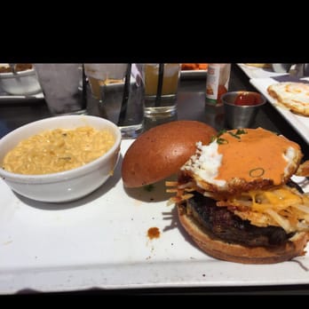 Crave Kitchen & Bar - Breakfast burger has chorizo, hash browns, fried egg and more with green chile Mac n cheese - Cafes Near Me - El Paso, Texas