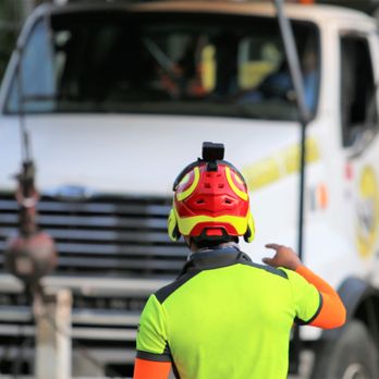 Medrano's Tree Service - a man in safety gear standing in front of a truck - Tree Services Near Me Medrano's Tree Service - a man in safety gear standing in front of a truck - Tree Services Near Me