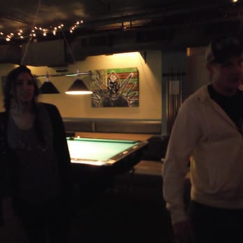 Corner Pocket - a man and a woman standing in front of a pool table - Dive Bars Near Me - Seattle, Washington