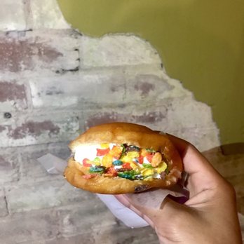 Novel Ice Cream - Honey lavender ice cream in a donut with fruity pebbles. - Desserts Near Me - Phoenix, Arizona