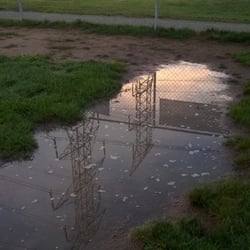 Canton Dog Park - Electrical transmission lines reflecting on one of the many puddles at the dog park.