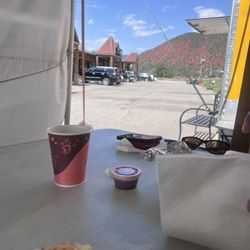 JC Food Truck - Mostly eaten breakfast burrito with eggs, beans, potatoes, and bacon.
