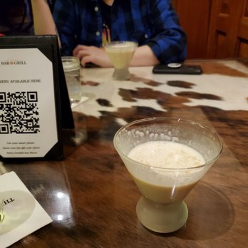 The Driskill Bar - Eggnog and cow table - Lounges Near Me - Austin, Texas
