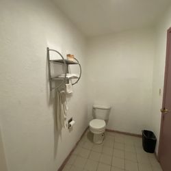 Valley Motel - Your towel rack... with two tiny, threadbare, rough towels, and two similarly threadbare washcloths... Good luck getting dry with just one.