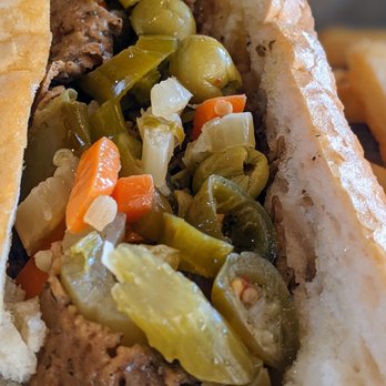 Buona - Close-up of the beefless sandwich (aka vegan beef) with optional hot pepper mix (giardiniera) - Sandwiches Near Me - Rosemont, Illinois Buona - Close-up of the beefless sandwich (aka vegan beef) with optional hot pepper mix (giardiniera) - Sandwiches Near Me - Rosemont, Illinois