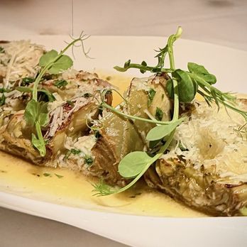 The Sardine Factory - APPETIZERS *SAUTÉED ARTICHOKES (V) 24 WHITE WINE LEMON BUTTER SAUCE | SHAVED PECORINO ROMANO CHEESE - Steakhouses Near Me - Monterey, California