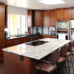 Kitchen Concepts - Here you see a kitchen in the classic shaker door style in birch wood with a mahogany stain and black glazing...
