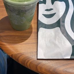 Ham and Swiss croissant with a matcha drink Ham and Swiss croissant with a matcha drink