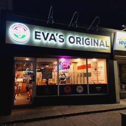 Eva's Original Chimneys - Storefront at night