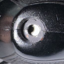 Chips and rough finish. Orange filler used in wood finishing. Fitment terrible screw hole misaligned.