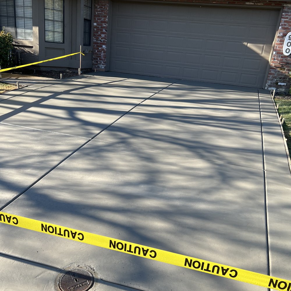 This photo shows the beautiful new driveway with tree shadows falling over it. This photo shows the beautiful new driveway with tree shadows falling over it.