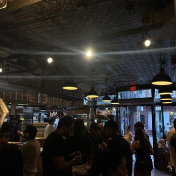 L’industrie Pizzeria - Inside the restaurant. No seating but standing bar tops all around - Pizza Near Me - New York, New York L’industrie Pizzeria - Inside the restaurant. No seating but standing bar tops all around - Pizza Near Me - New York, New York