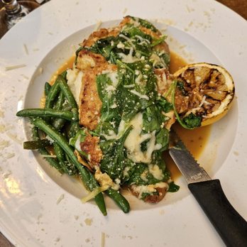 Hilltop Restaurant & Bar - Two large lemon chicken breasts on top of mashed potatoes with a side of green beans - Bars Near Me - Lockport, New York