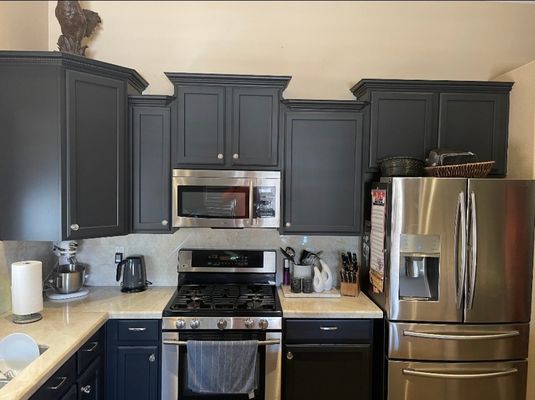 Kitchen Cabinets 2 tone - We repainted these cabinets and brought new life to an old kitchen. This customer was from New Orleans and wanted to make her kitchen feel like home with a deluxe 2 tone!