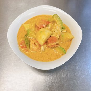 Thai Cuisine - A combination of shrimp and chicken with avocado, potatoes, carrots, bell peppers, and basil leaves in a special curry paste. - Thai Near Me - Evans Mills, New York Thai Cuisine - A combination of shrimp and chicken with avocado, potatoes, carrots, bell peppers, and basil leaves in a special curry paste. - Thai Near Me - Evans Mills, New York