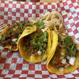 Al pastor street tacos with red and green salsa
