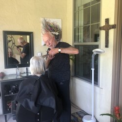 Santinos - Santino cutting hair in his beautiful patio garden setting