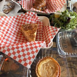 Our meal (quiche, breakfast sandwich, pear tart, and almond croissant)