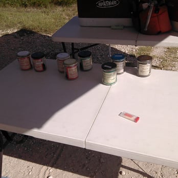 Desert Blend Jerky - a table with a laptop and cans of paint - Specialty Food Near Me - Austin, Texas
