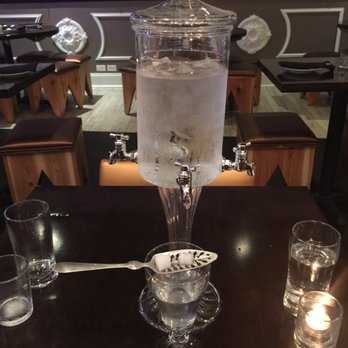 Mora Asian Fusion - Ice water fountain and glass of absinthe with sugar cubes and slotted spoon - Sushi Bars Near Me - Plainfield, Illinois Mora Asian Fusion - Ice water fountain and glass of absinthe with sugar cubes and slotted spoon - Sushi Bars Near Me - Plainfield, Illinois