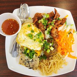 Com Tam (broken rice with grill pork,eggs,meat ball,veggies) and delicious fish sauce. Com Tam (broken rice with grill pork,eggs,meat ball,veggies) and delicious fish sauce.