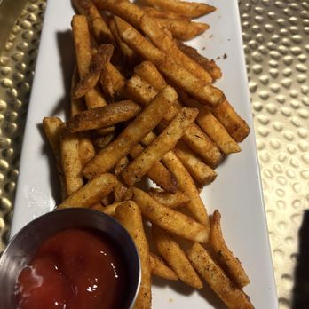 Neat & Noble - French fries with Cajun seasoning and a side of ketchup - Bars Near Me - Summerville, South Carolina Neat & Noble - French fries with Cajun seasoning and a side of ketchup - Bars Near Me - Summerville, South Carolina