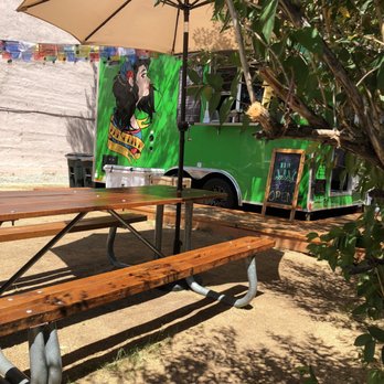 The Olive - a picnic table with a green food truck in the background - Mediterranean Near Me - Buena Vista, Colorado The Olive - a picnic table with a green food truck in the background - Mediterranean Near Me - Buena Vista, Colorado