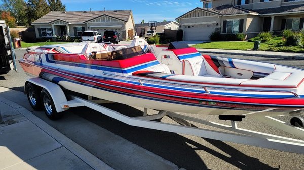 1998 Ultra 21' Open Bow - This Ultra was in overall good shape but the maintenance done on it previously was more of a quick wipe down and a spray wax. We spent several hours cleaning up all the areas around the hardware before even washing it. The gelcoat was is pretty good shape but was getting a little oxidized and had a lot of built up hard water spots near the rub rail. We did an acid wash to really get it cleaned up and then a full machine polish to address the oxidation, restore gloss and leave a nice ceramic based sealant for protection. The interior was fully detailed as well. 1998 Ultra 21' Open Bow - This Ultra was in overall good shape but the maintenance done on it previously was more of a quick wipe down and a spray wax. We spent several hours cleaning up all the areas around the hardware before even washing it. The gelcoat was is pretty good shape but was getting a little oxidized and had a lot of built up hard water spots near the rub rail. We did an acid wash to really get it cleaned up and then a full machine polish to address the oxidation, restore gloss and leave a nice ceramic based sealant for protection. The interior was fully detailed as well.