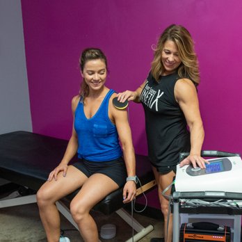 Kinetix Body Science - Tammy Marquez using the Neubie to scan for areas of compensation - Massage Therapy Near Me - Austin, Texas