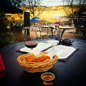 Vindemia Estate Winery - Our view of the vineyard with our wine and fresh bread and olive oil :) - Wine Bars Near Me - Temecula, California Vindemia Estate Winery - Our view of the vineyard with our wine and fresh bread and olive oil :) - Wine Bars Near Me - Temecula, California