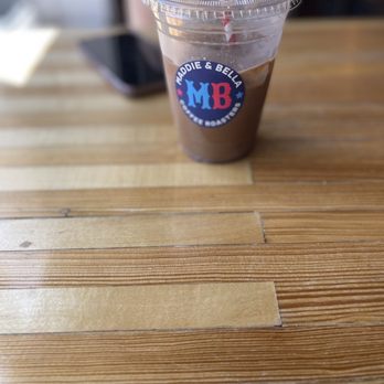 Maddie & Bella Coffee Roasters - a cup of coffee with a straw - Coffee & Tea Near Me - Toledo, Ohio