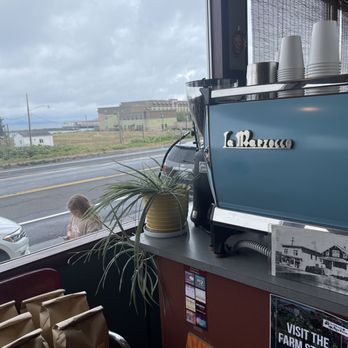Astoria Coffee - a view of a street through a window - Coffee & Tea Near Me - Astoria, Oregon