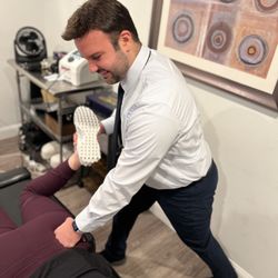 ProClinix Sports Physical Therapy & Chiropractic - Ardsley - Dr Joseph Recchia, DC, ATC - Chiropractor stretching the piriformis muscle for low back discomfort