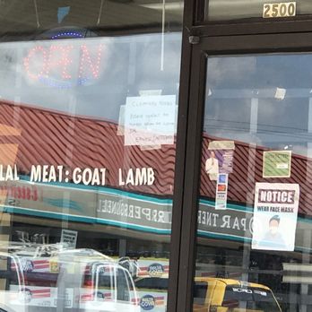 Ashtown African Market - the reflection of a taxi cab in the window - International Grocery Near Me - Columbus, Ohio Ashtown African Market - the reflection of a taxi cab in the window - International Grocery Near Me - Columbus, Ohio