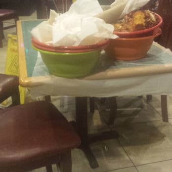LA Crawfish Shack - Just one of the many piles of bowls left on several tables.  Spilled drink stayed on the floor for at least an hr and a half - Cajun/Creole Near Me - Houston, Texas