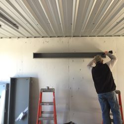 Lite Electric Service - Tony mounting some gutter for some pvc pipes to go into.