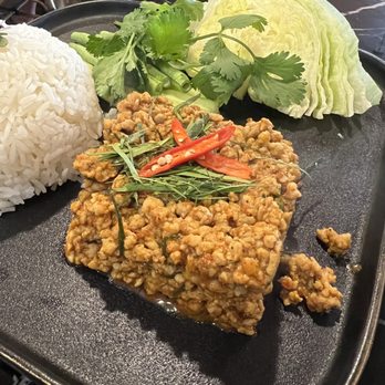 Four Region Thai Cuisine - Khuar Gling (Pork version) with rice, matchstick cucumbers, cilantro, cut long beans and a wedge of iceberg lettuce - Thai Near Me - Spring, Texas