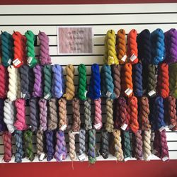 String Theory Yarn Shop - Our lovely wall of Koigu KPM and KPPPM!