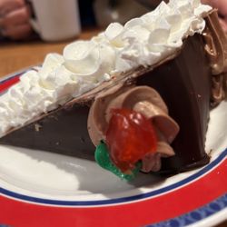 Palace Diner - 7 layer chocolate mousse cake with whipped cream on top !
